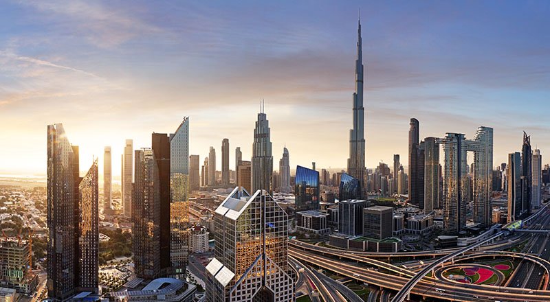 Dubai skyline at sunset with traffic - aerial view, United Arab Emirates